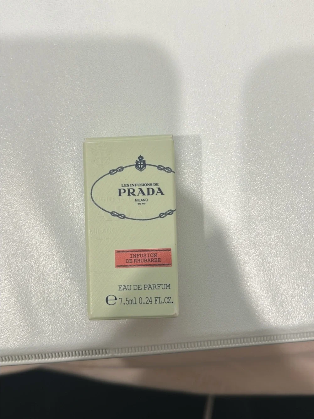 Prada pale mint green box with coral-pink label